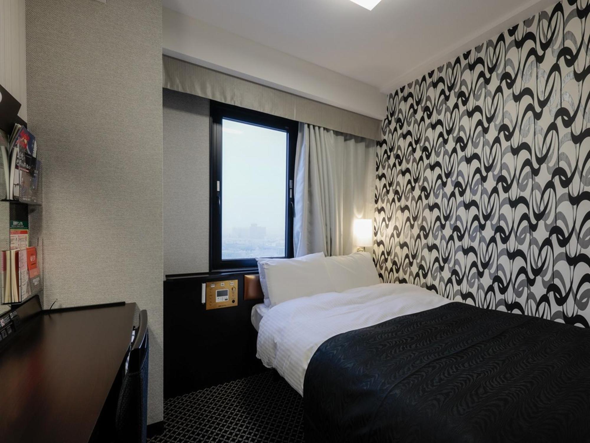Apa Hotel Tonami Ekimae Buitenkant foto